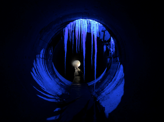 Illustration for article titled Unreal photographs of tunnels look like portals into the underworld